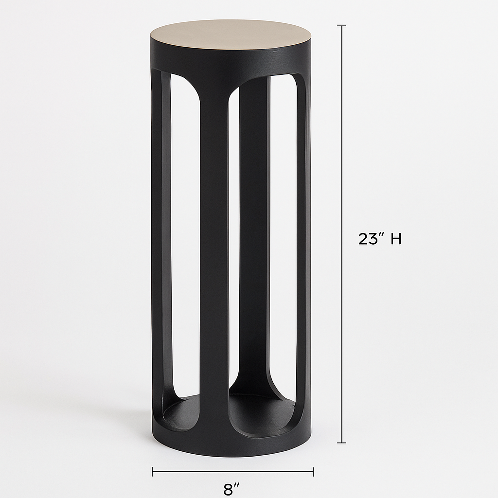 Black cylindrical side table with beige top on a white background
