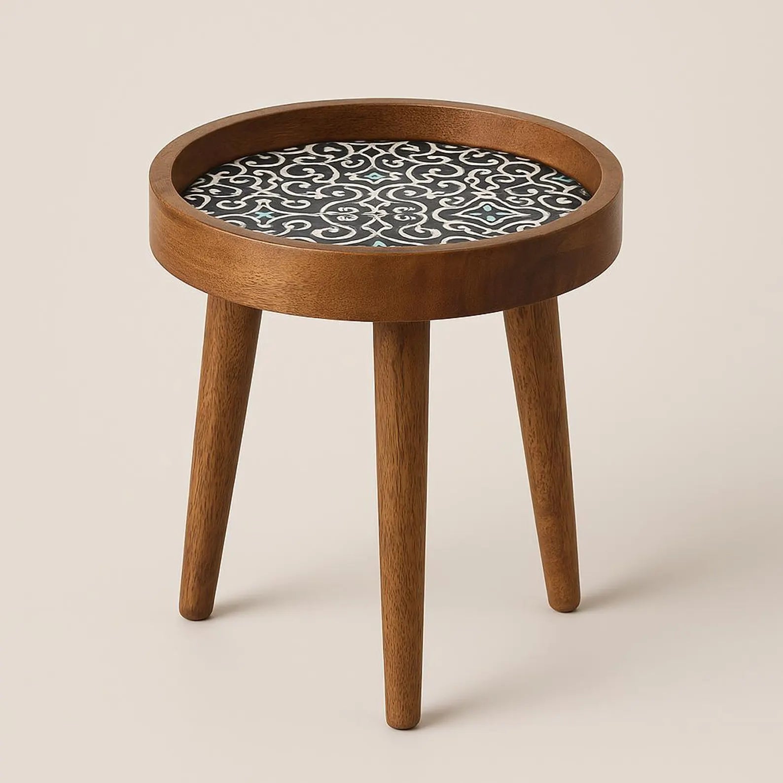 Wooden side table with a patterned ceramic top on a beige background