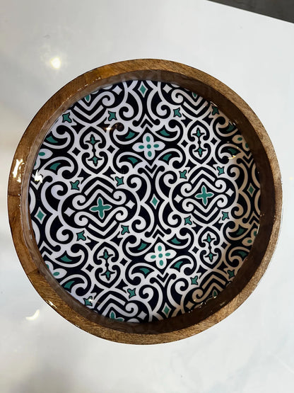 Decorative Artisan wooden coffee with a geometric pattern on a white surface