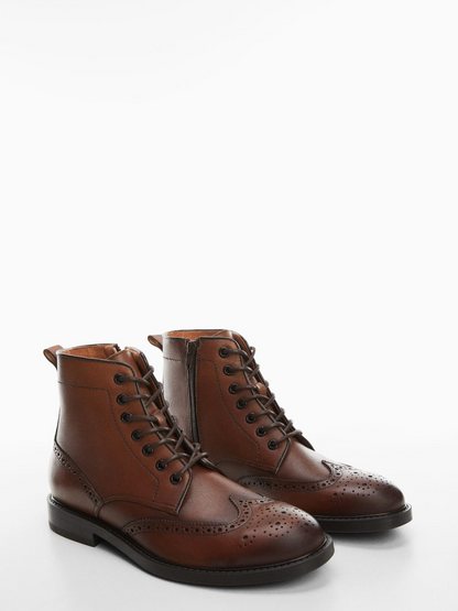 Die-cut leather ankle boots