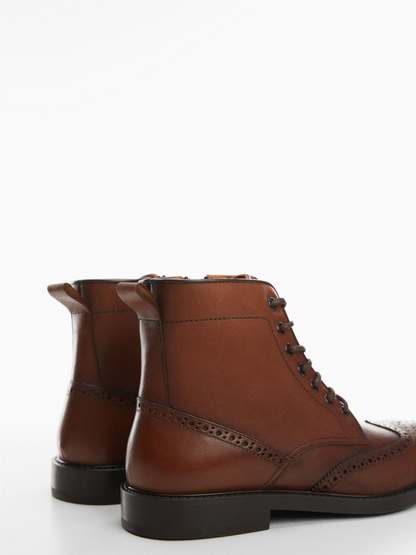 Die-cut leather ankle boots