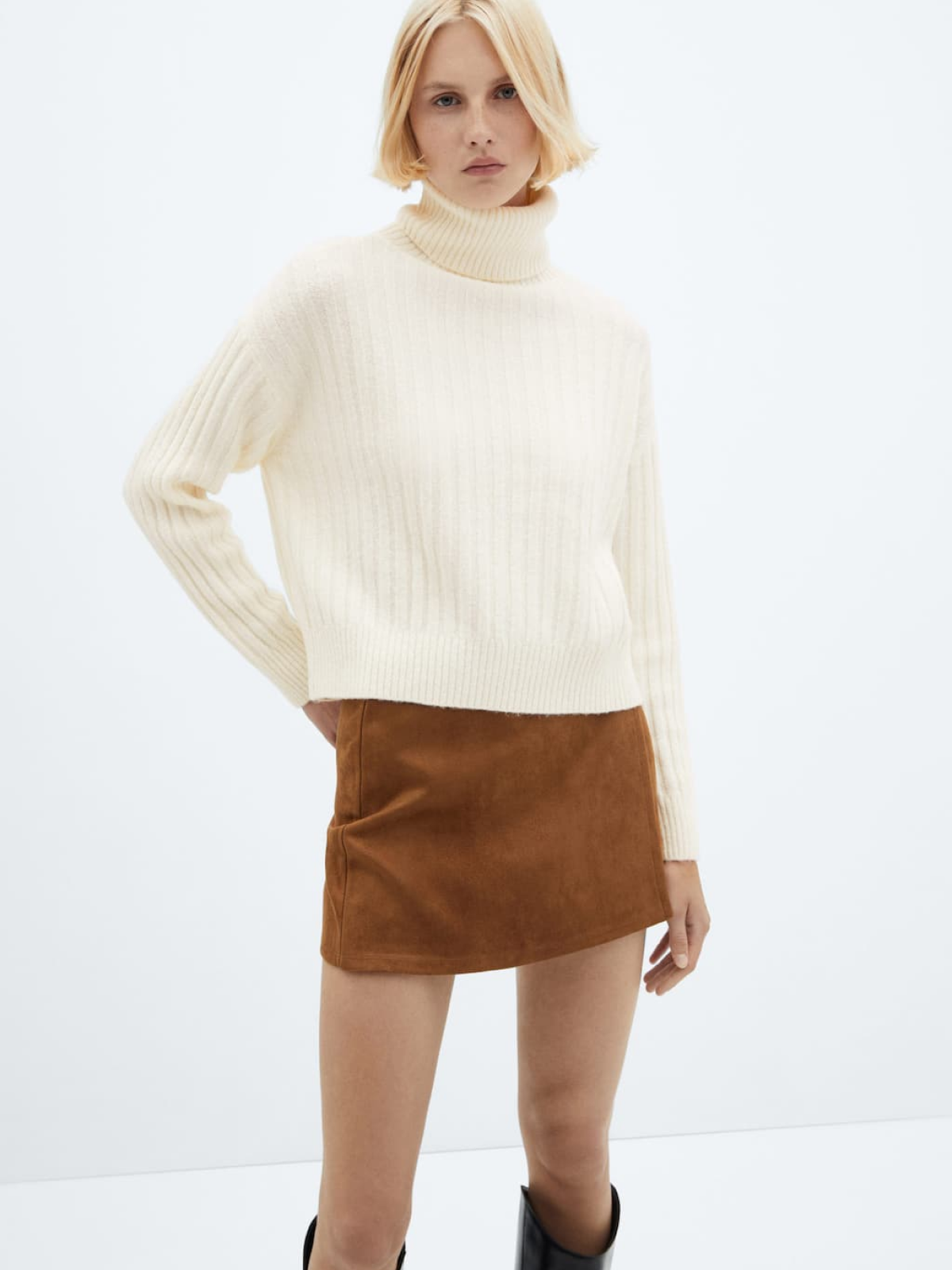 Rolled neck cable sweater